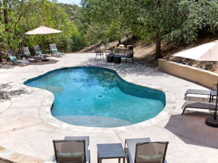 Pool and terrace seating at a managed property
